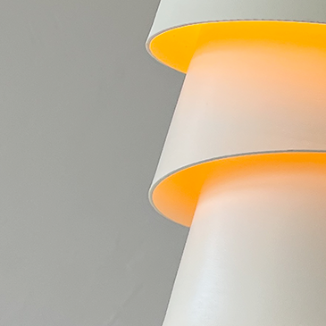 Blossom Pendant — layered shade glowing warm orange from within